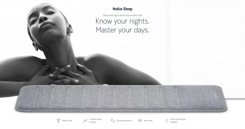 Black and white advertisement featuring a woman resting with eyes closed above a grey sleep tracking pad by Bryce Duffy