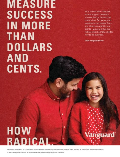 A father and young daughter smile together in an advertisement for Vanguard, with text focusing on success beyond dollars and cents.