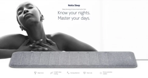 Black and white advertisement featuring a woman resting with eyes closed above a grey sleep tracking pad by Bryce Duffy