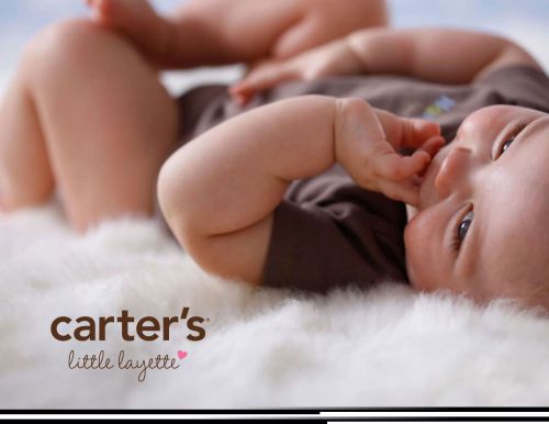 Infant lying on a white fluffy surface wearing a brown shirt, promoting Carter's little layette clothing line, baby looking at the camera.