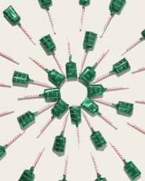 Overhead studio shot of green foil wrapped lollipops with red and white striped sticks arranged in a radial pattern on a white surface.