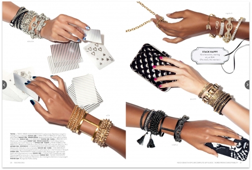 Close-up of jewelry advertisement with an assortment of bracelets on model's arms, showcasing a collection of accessories with playing cards and purses.