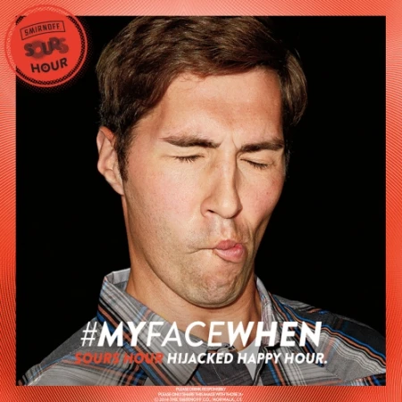 Man with closed eyes and pursed lips in an advertisement for Smirnoff Sours Hour, featuring red, orange, and black color scheme.