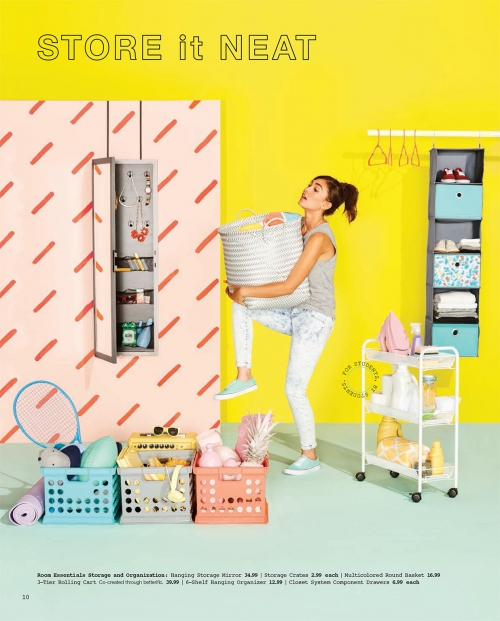 Young woman carries laundry basket in bright room with storage solutions, including shelving, rolling cart, and storage mirror.