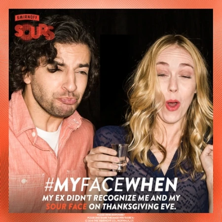 Adult man and woman with playful, exaggerated expressions. The woman is holding a shot glass. The image is framed by an orange border.