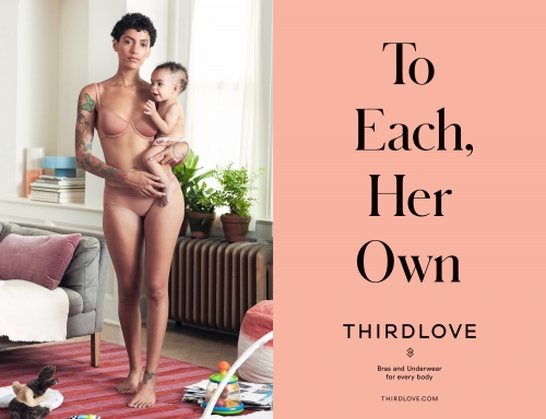 A woman holds a baby indoors, wearing matching bra and underwear, next to brand messaging, promoting body positivity and comfort.