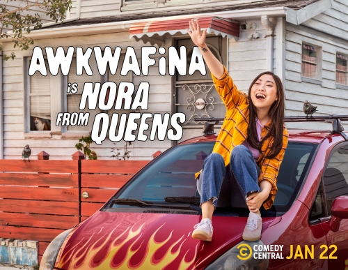 Actress Awkwafina sits on a red car hood with flames, in front of a white house for the TV show "Nora From Queens".