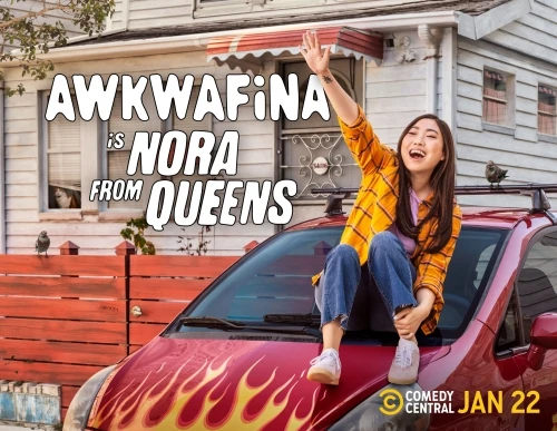 Actress Awkwafina sits on a red car hood with flames, in front of a white house for the TV show "Nora From Queens".