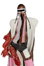 Model wearing white sunglasses, a sheer printed face cover, cream structured vest, black shorts, and pink thigh-high boots