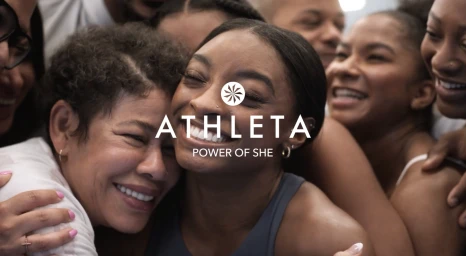 Close-up group portrait of smiling diverse women embracing, directed by Danielle Levitt.