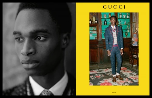 An eye-level fashion shot features a Black male model in a suit, presented in a vertically split format, half B&W, half color, next to the Gucci logo.