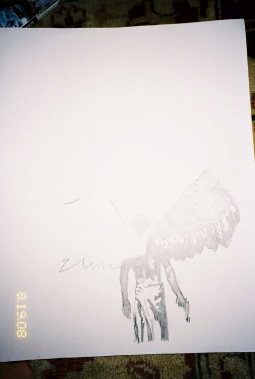 Black and white drawing on white paper features an angel-winged figure holding a gun, rendered in pencil-like strokes on a patterned surface.