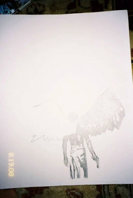 Black and white drawing on white paper features an angel-winged figure holding a gun, rendered in pencil-like strokes on a patterned surface.