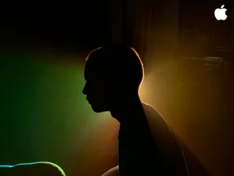 Silhouette profile of a man in dim lighting with warm rim light and green ambient light by Jake Michaels
