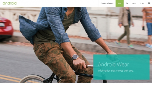 A man rides a bicycle on a city street wearing a smartwatch, with pedestrians visible in the background and an Android Wear advertisement.