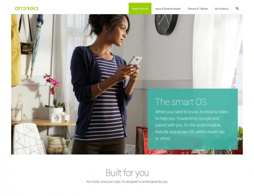 Woman looks at Android phone in brightly lit room with minimal decor, modern feel, and cool, neutral colors, showcasing phone features.