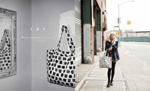 A woman carrying a patterned tote bag walking down a city street by photographer Rennie Solis.