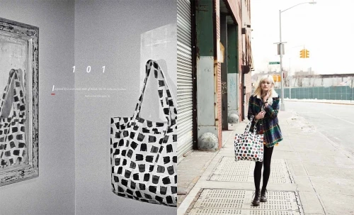 A woman carrying a patterned tote bag walking down a city street by photographer Rennie Solis.