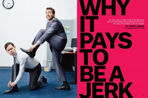 Two businessmen in a playful office scenario: One stands, placing a foot on the back of another who is kneeling and tying his shoe.