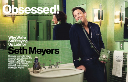 Seth Meyers in a bathroom, posing with a rotary phone and wearing a robe, in a magazine cover editorial shot with a green tiled interior.