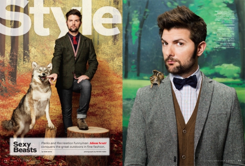 Adam Scott poses in a woods-themed editorial shoot with a wolf standing on its hind legs and a small chipmunk on his shoulder.