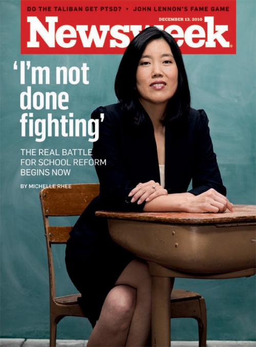 Newsweek cover featuring a woman in a blazer sitting at a school desk. The cover story is titled 'I'm not done fighting'.
