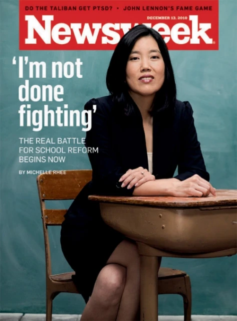 Newsweek cover featuring a woman in a blazer sitting at a school desk. The cover story is titled 'I'm not done fighting'.