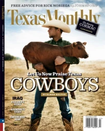 Man wearing a cowboy hat and green shirt holding a calf in an outdoor field under a blue sky.