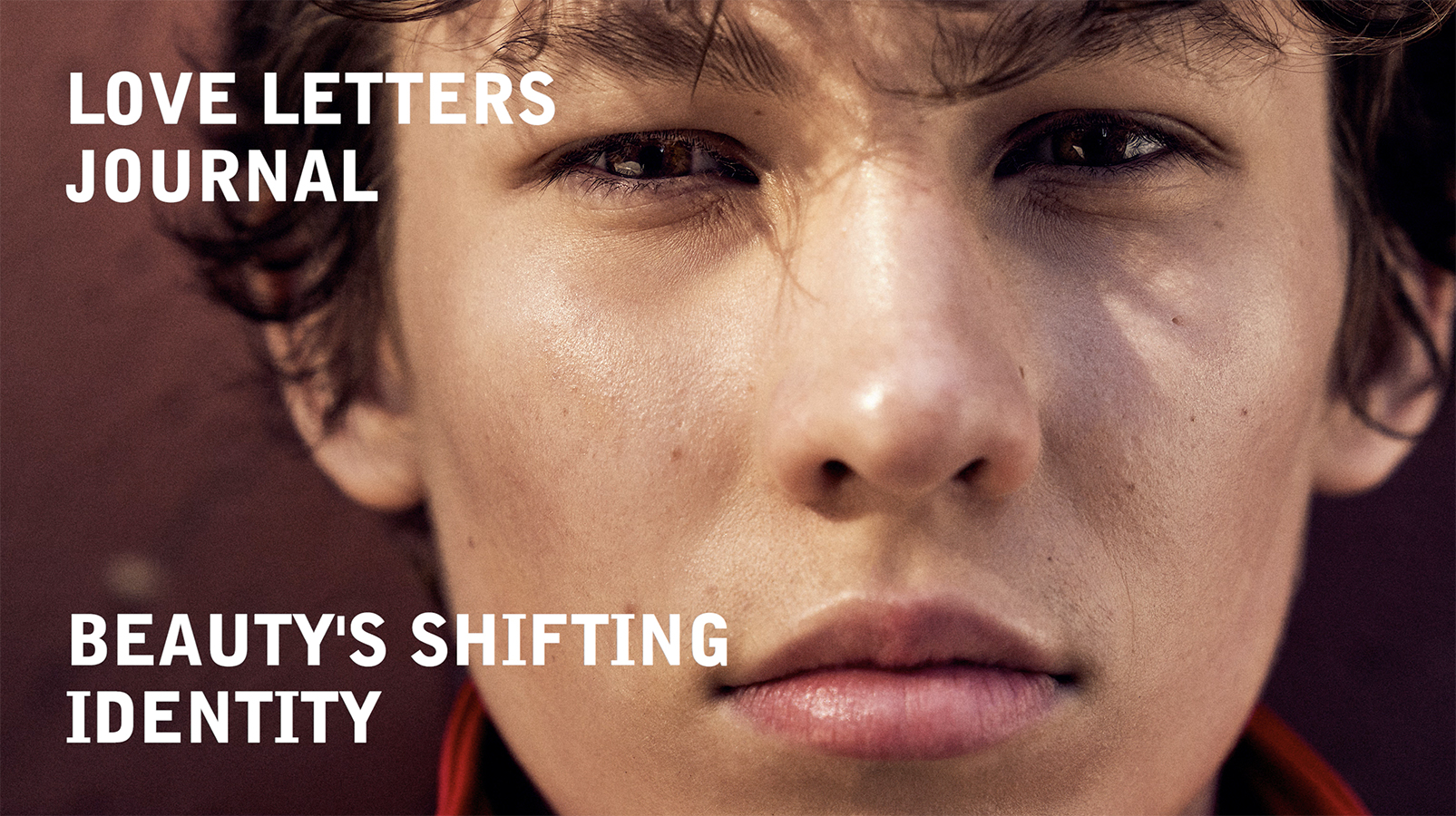Close-up portrait of a young person with fair skin, brown eyes, and brown hair with text overlay. Beauty and fashion concept.
