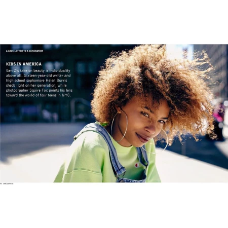 Close-up portrait of a teenage girl with curly hair and large hoop earrings wearing a lime green sweatshirt and denim overalls outdoors in NYC.