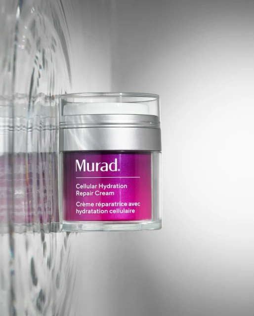 Studio shot of Murad Cellular Hydration Repair Cream in clear jar with silver lid, product label in pink, purple, and white.