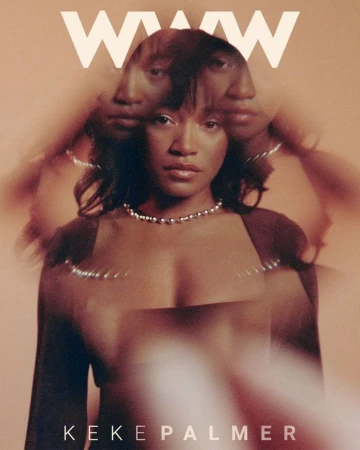 Keke Palmer on a magazine cover with a blurred effect, wearing a dark top and a pearl necklace, against a neutral orange background.