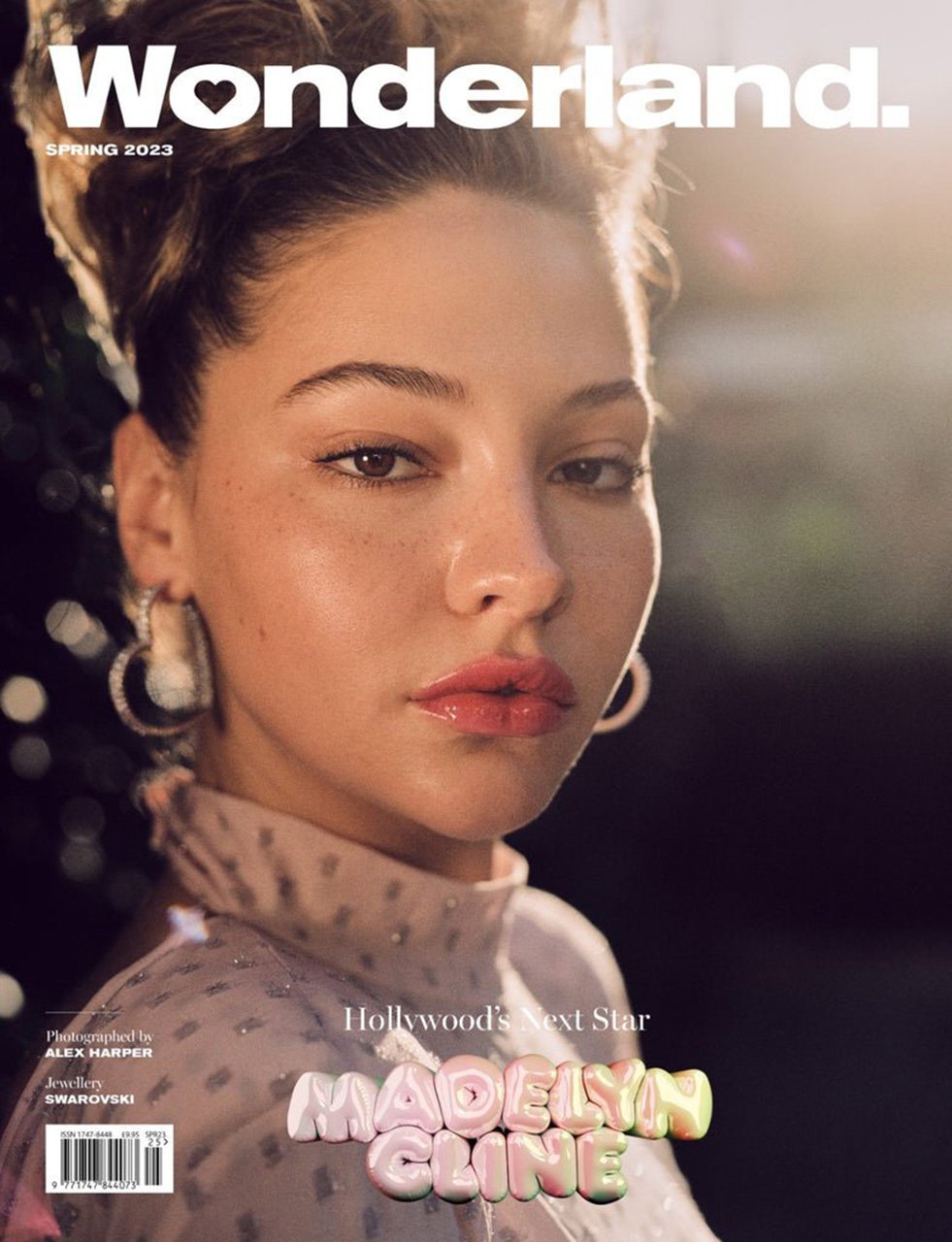 Wonderland magazine cover featuring Madelyn Cline, spring 2023, close-up of a young woman with earrings, soft lighting, and blurred background.