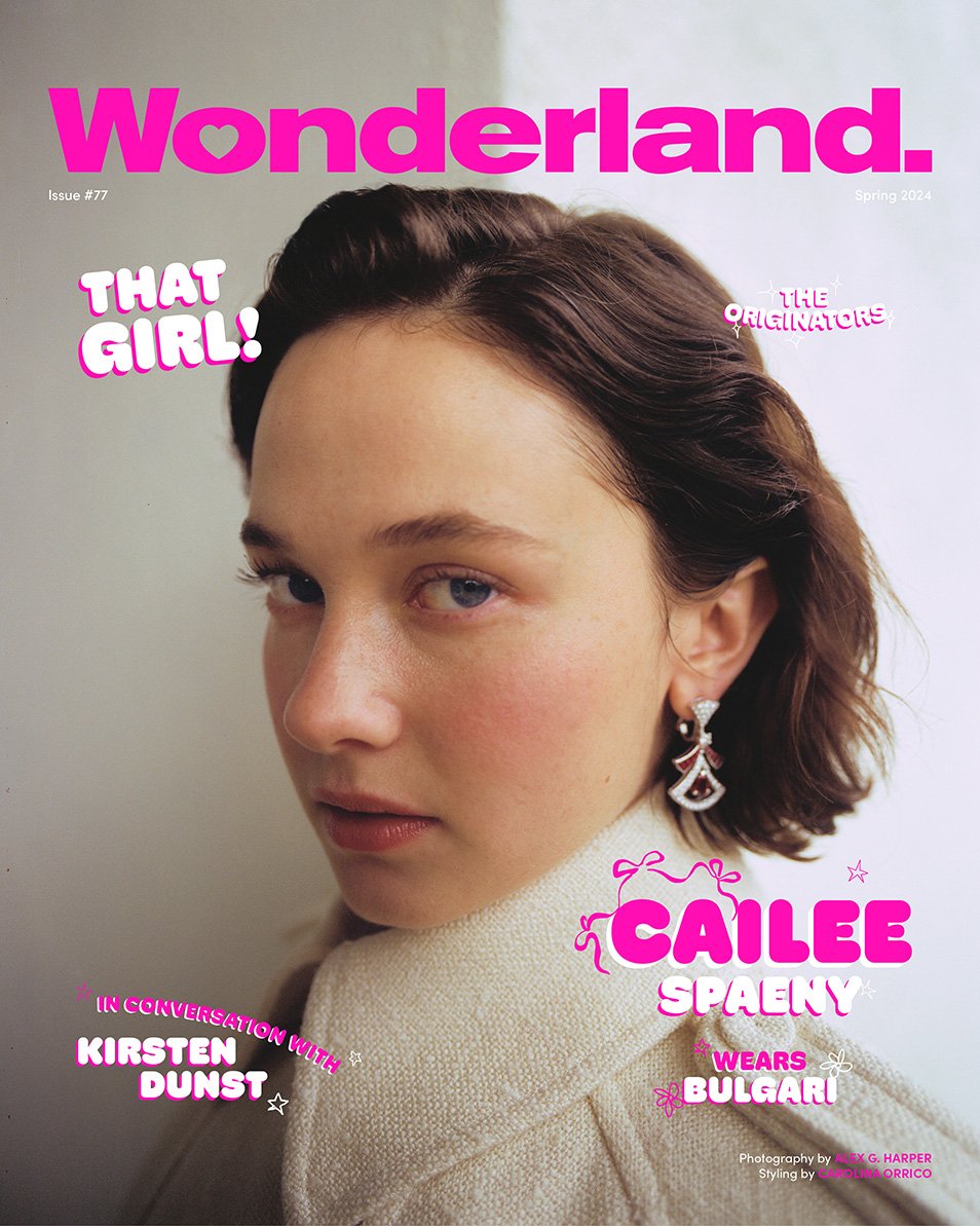 Close-up studio shot of Cailee Spaeny on the cover of Wonderland magazine, wearing a cream-colored cable-knit sweater and Bulgari earrings.