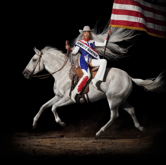 Beyoncé rides a white horse while holding an American flag, set against a stark black background. She wears a cowboy hat and sash.