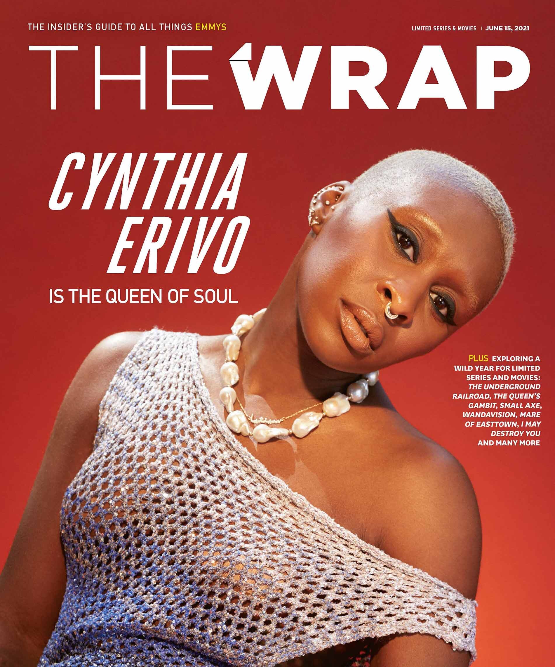 Cynthia Erivo on magazine cover: close-up of a black woman with a shaved head, wearing a pearl necklace and silver mesh top against a red background.