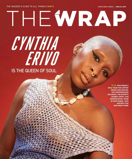 Cynthia Erivo on magazine cover: close-up of a black woman with a shaved head, wearing a pearl necklace and silver mesh top against a red background.