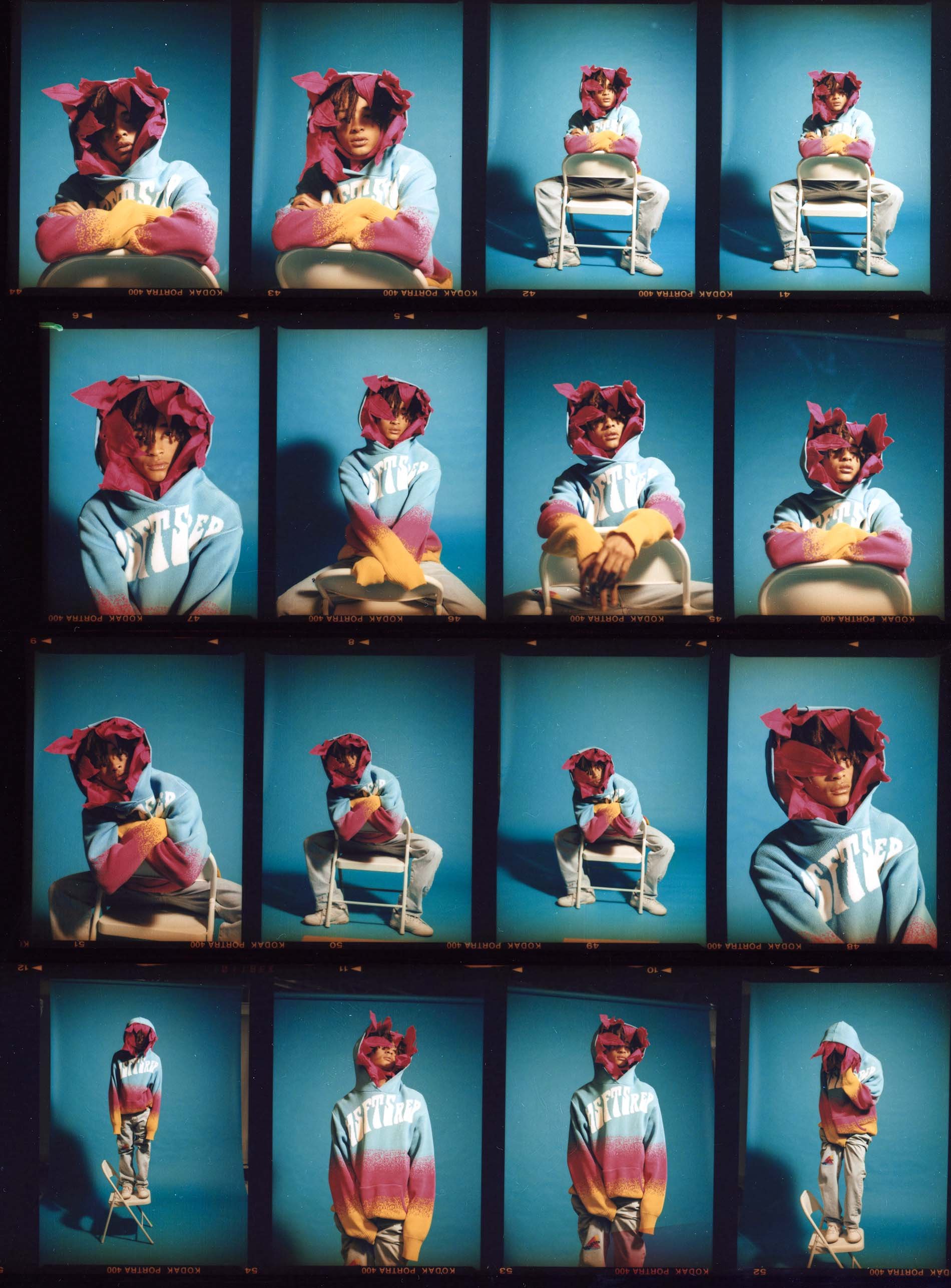 A collection of frames shows a person in a colourful hooded top and a burgundy flower-like hood posing against a blue backdrop.