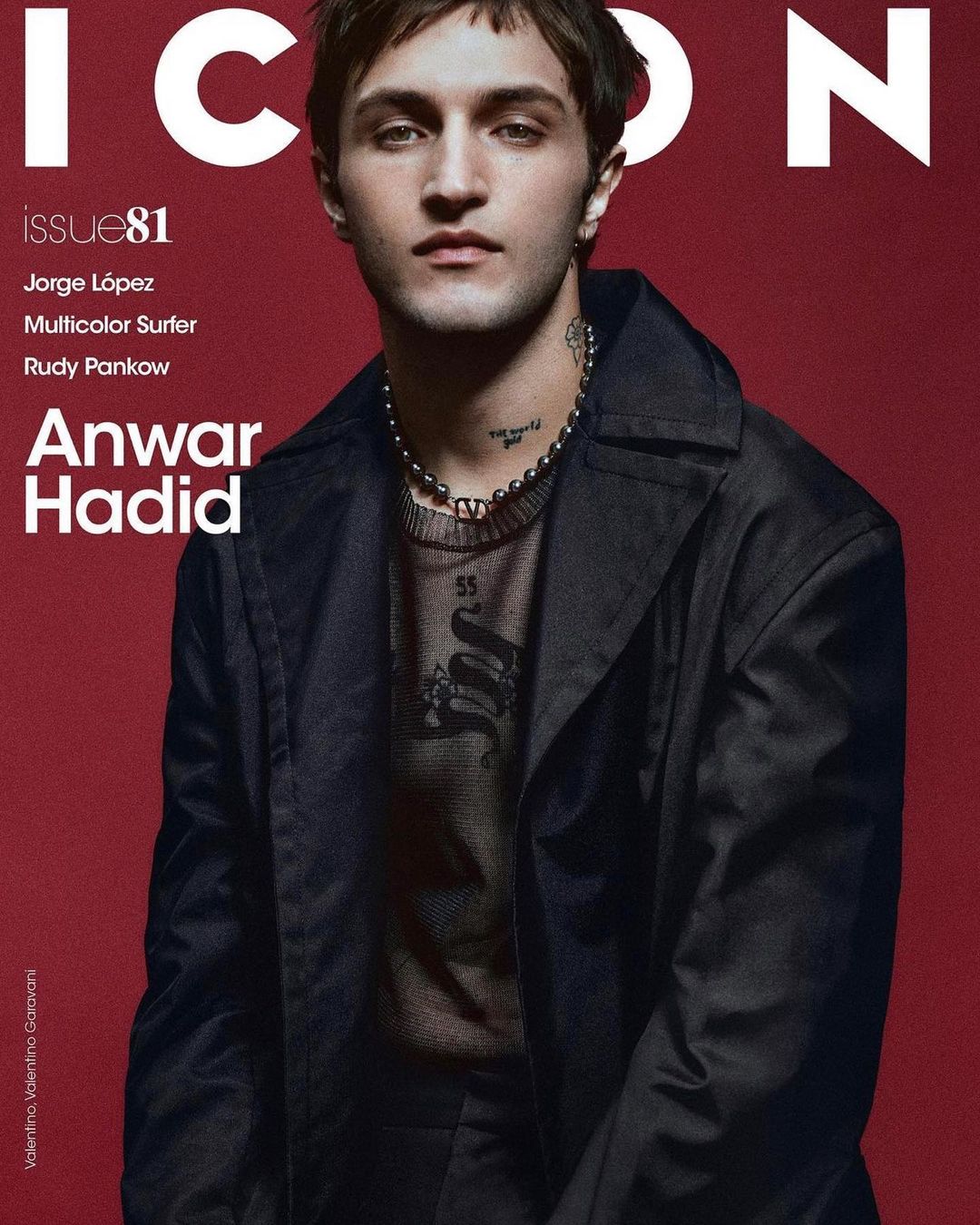 Magazine cover featuring Anwar Hadid in a dark jacket and necklace, set against a solid red background, with bold white ICON lettering.
