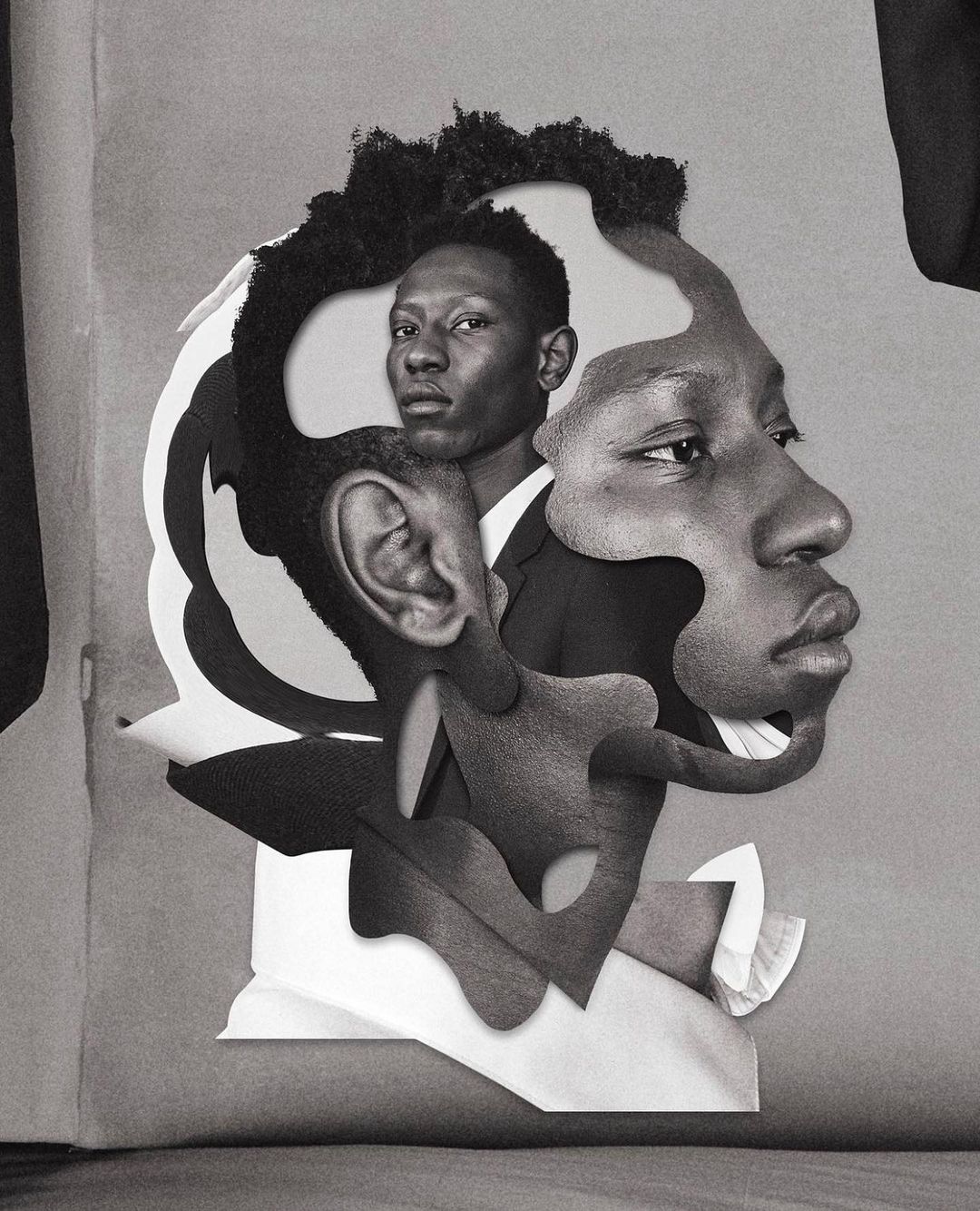 Monochrome collage featuring two African American adult males in suits, combined with cutout paper shapes, set against a muted gray background.