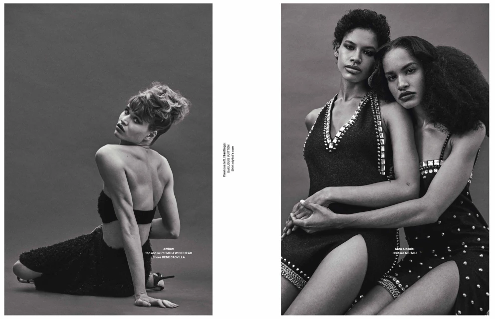 Monochrome studio shot features a seated female model with updo, back facing camera, and two embracing models in embellished dresses.