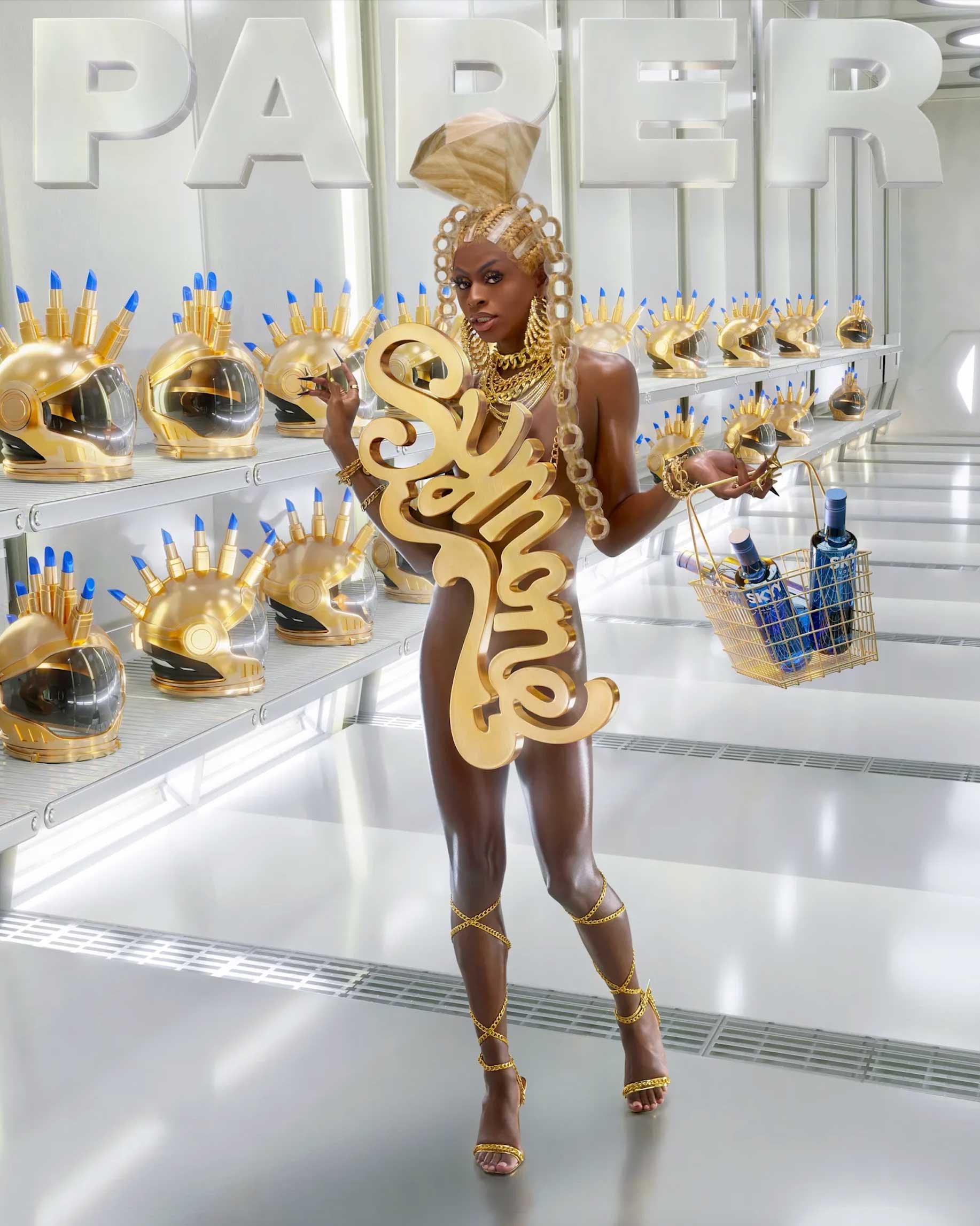 A dark-skinned model with an elaborate golden headdress, jewelry, and heels, stands in a sleek, white set, holding a logo and basket of SKYY vodka.