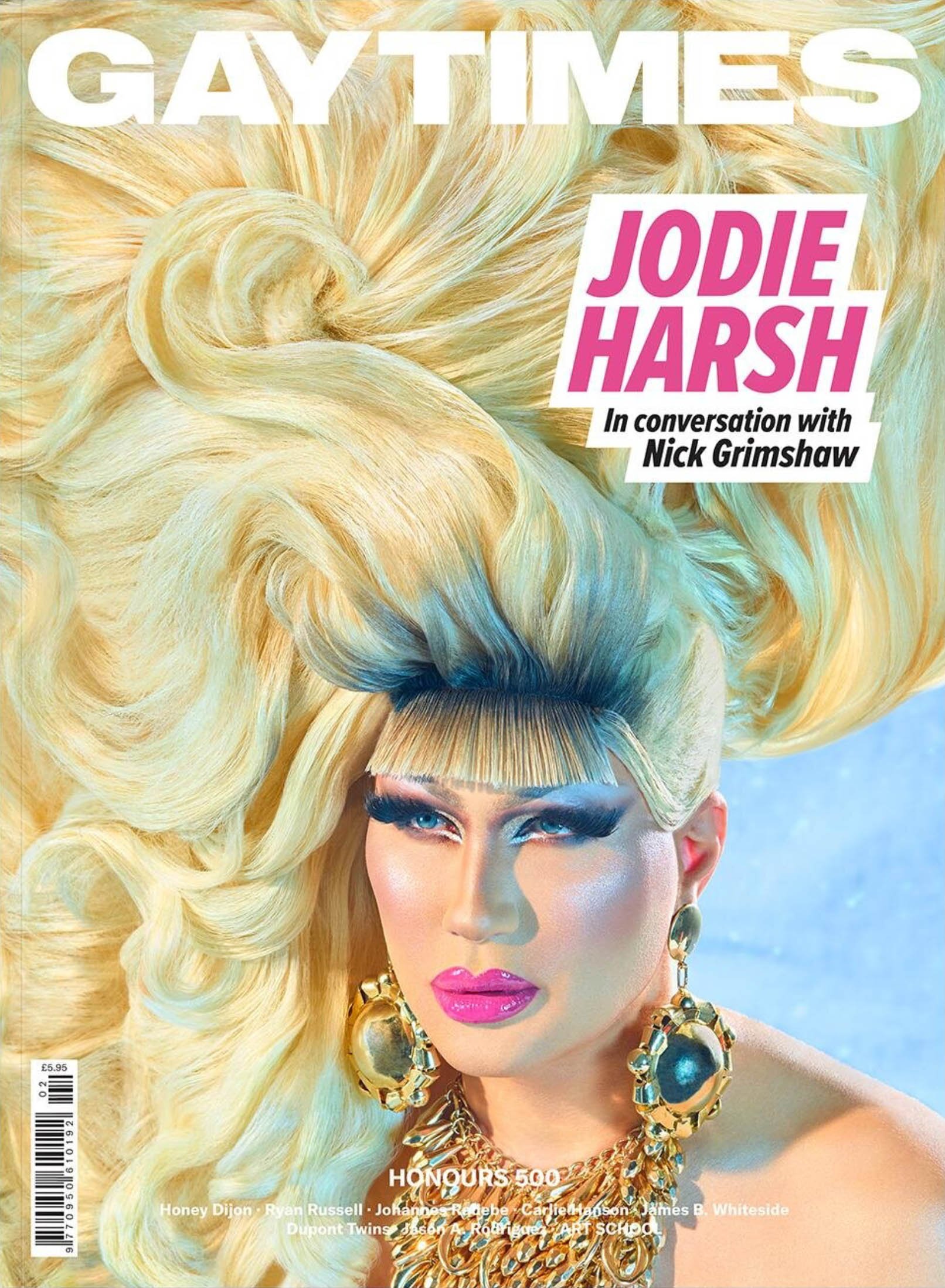 Magazine cover featuring Jodie Harsh with blonde hair, heavy makeup, and gold jewelry on a light blue background in a portrait orientation.