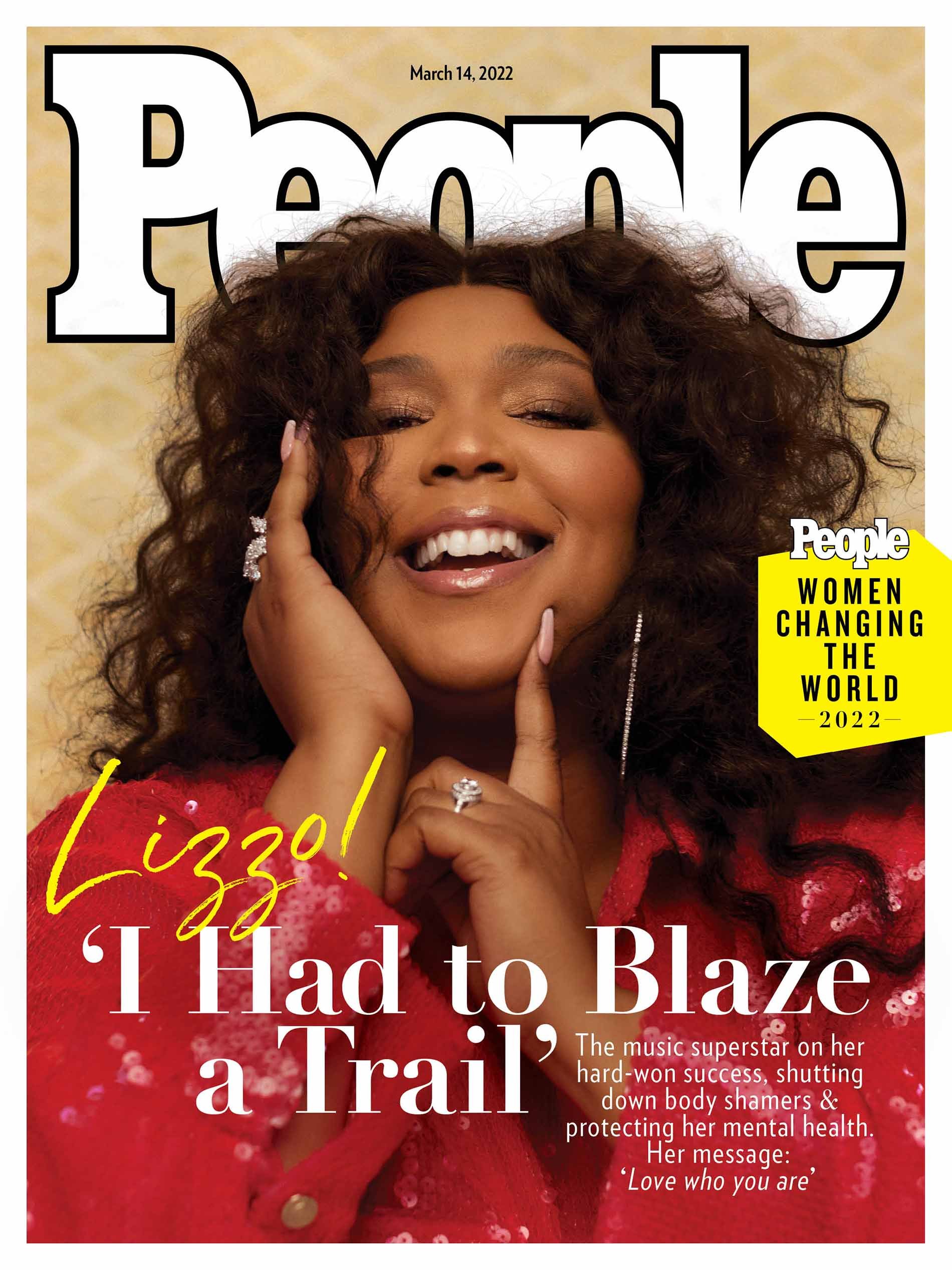 Lizzo smiles on the cover of People Magazine, March 14, 2022, wearing a red sequined jacket with statement rings and earrings.