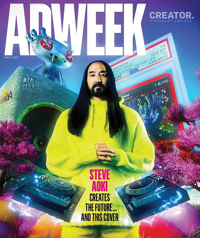 Magazine cover featuring Steve Aoki wearing yellow knit sweater, DJ equipment, and anime-style art against purple floral background.