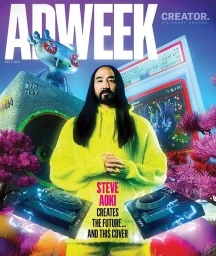 Steve Aoki with long black hair wearing a bright yellow sweater in a surreal surrealistic magazine cover portrait by Xavier Luggage