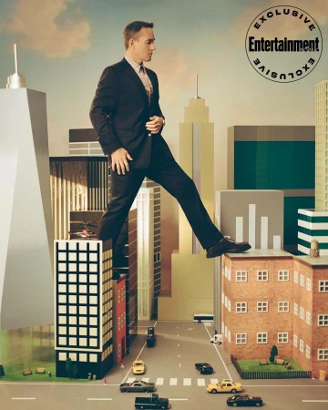 A man in a suit is walking on top of buildings in a city. Concept of a giant man among miniature buildings with cloudy skies.
