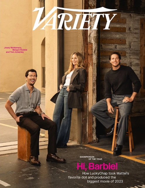 Magazine cover featuring Josey McNamara, Margot Robbie, and Tom Ackerley posing in an urban setting, promoting their work.