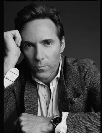 Portrait of a man in a textured blazer and striped shirt by Victoria Stevens