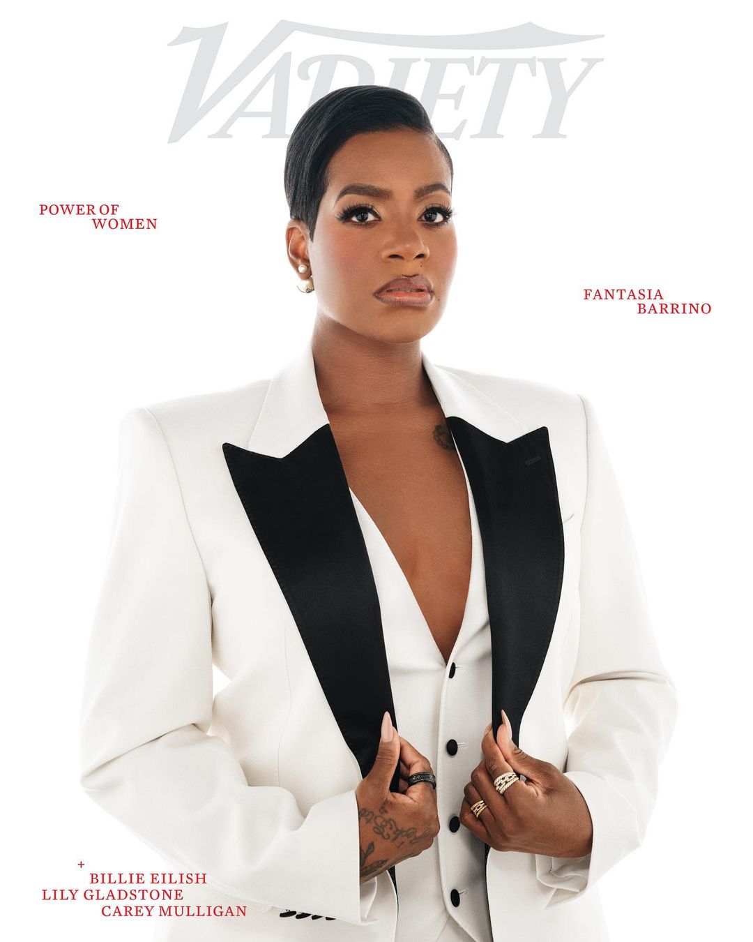Close-up of Fantasia Barrino on Variety cover, wearing a white suit with a black lapel, posing indoors with a bright, neutral backdrop.